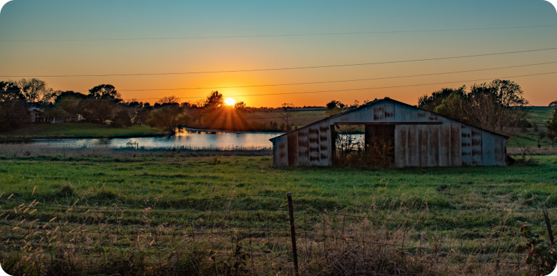 house field against sky sunset a5461